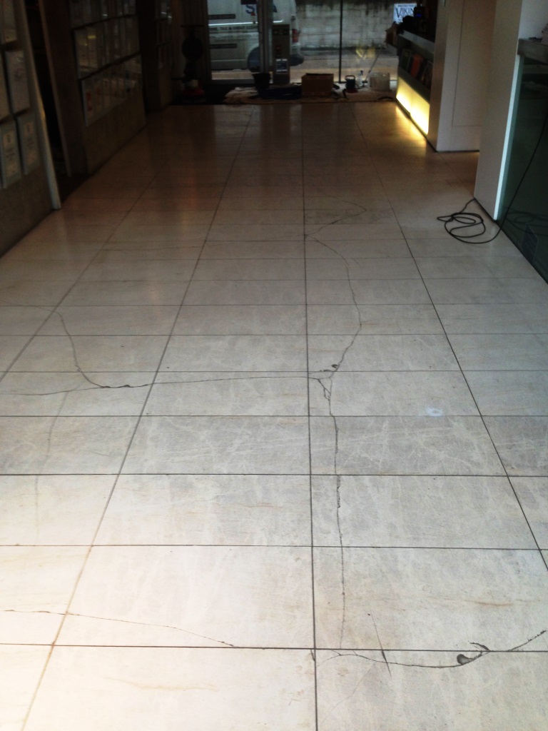 Damaged Limestone Tiled Floor in Wilmslow Before